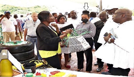 Dr Kwaku Afriyie (right), Minister of Environment, Science, Technology and Innovation, inspecting a shopping basket made from recycled plastic materials. Looking on is Dr Zenator Agyeman-Rawlings (arrowed), Member of Parliament for the Korle Klottey Constituency. Picture: ELVIS NII NOI DOWUONA